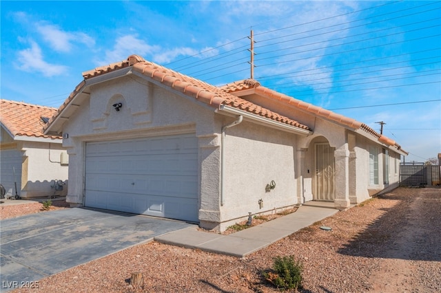 view of side of property with a garage