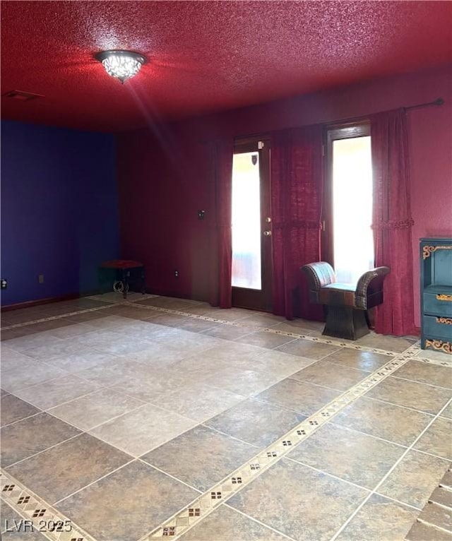 foyer featuring a textured ceiling