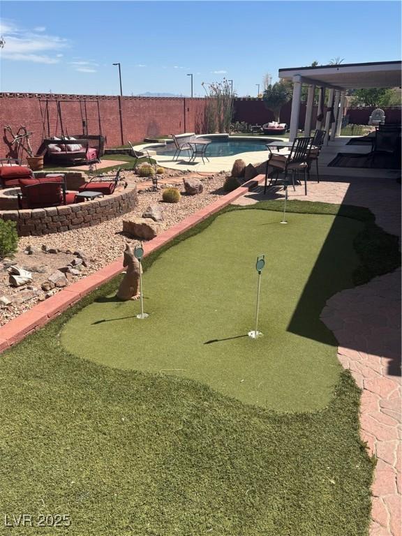 view of property's community with a patio area and a swimming pool