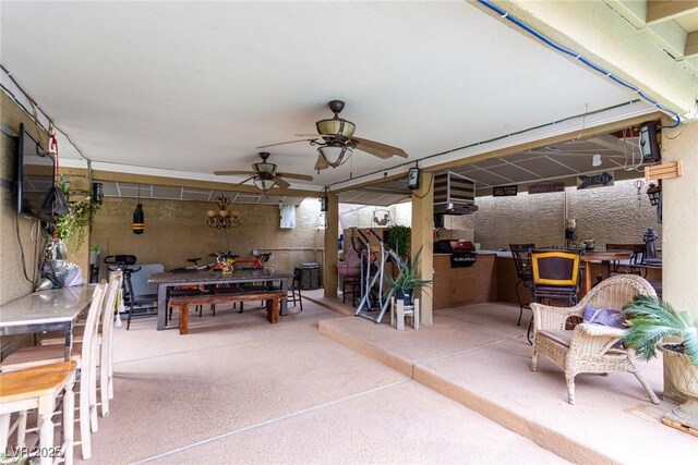 view of patio / terrace with area for grilling and ceiling fan