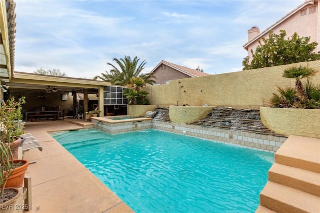 view of swimming pool with an in ground hot tub and a patio