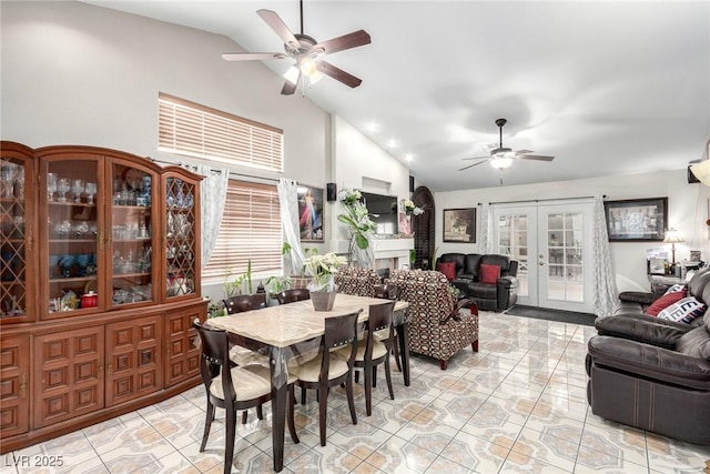 dining space featuring high vaulted ceiling, ceiling fan, and french doors