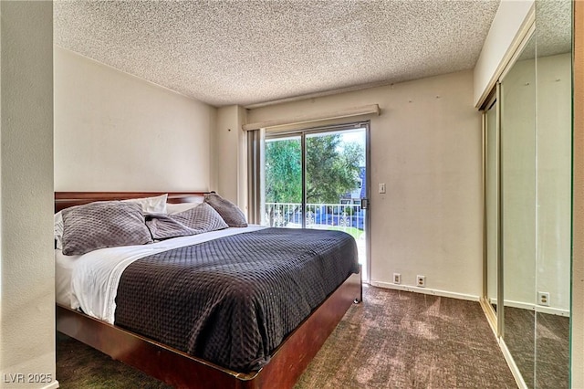 carpeted bedroom featuring access to exterior, a textured ceiling, and a closet