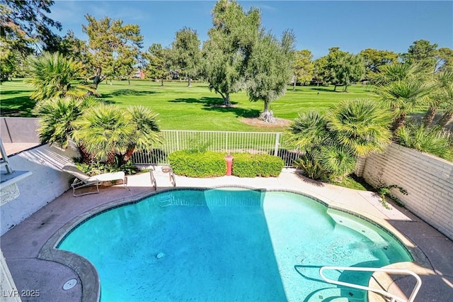 view of pool featuring a yard