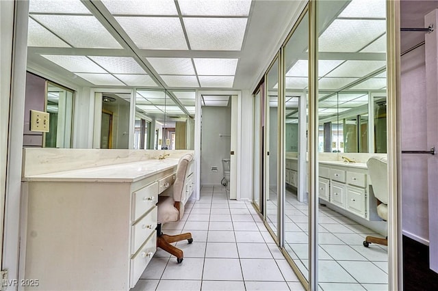 bathroom featuring tile patterned floors, toilet, and vanity