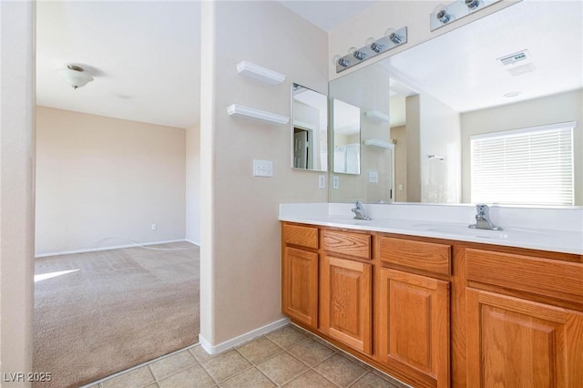 bathroom featuring tile patterned flooring and vanity