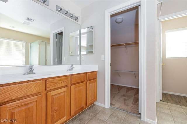 bathroom with vanity and tile patterned flooring