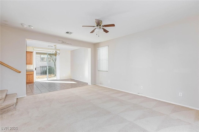 empty room with ceiling fan and light colored carpet