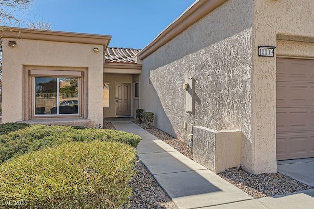 entrance to property featuring a garage