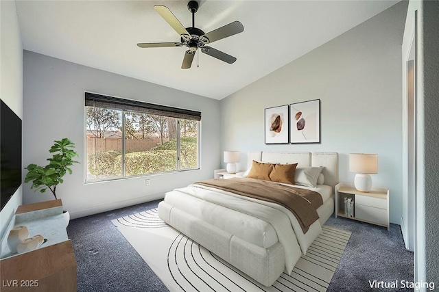 carpeted bedroom with vaulted ceiling and ceiling fan