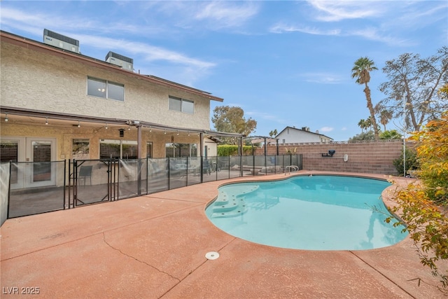 view of pool featuring central AC unit and a patio area