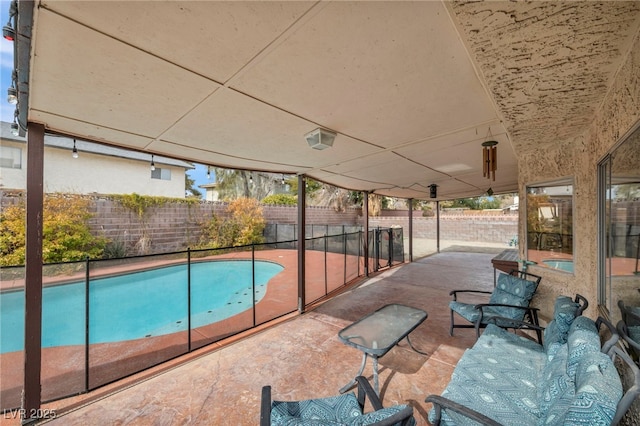 view of swimming pool featuring a patio area