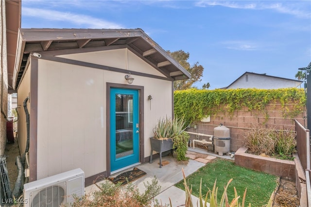 view of exterior entry featuring ac unit