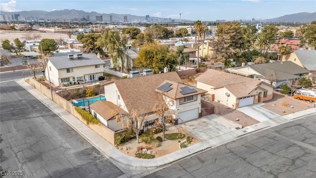 birds eye view of property with a mountain view