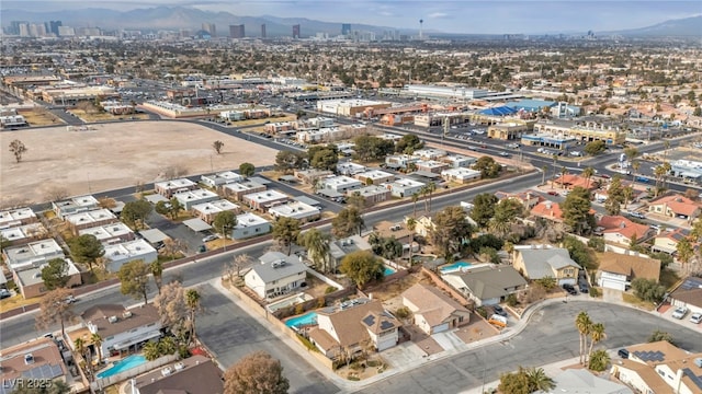 birds eye view of property with a mountain view