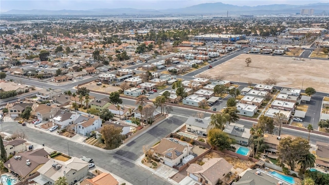 birds eye view of property featuring a mountain view