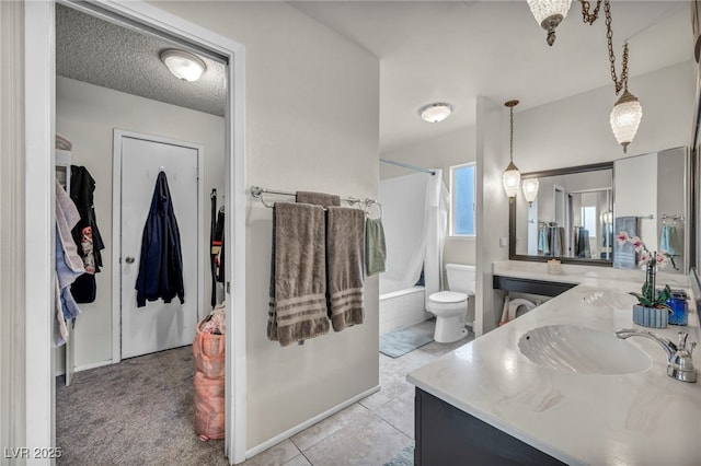 full bathroom featuring toilet, a textured ceiling, vanity, shower / bath combo with shower curtain, and tile patterned flooring