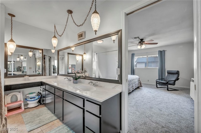 bathroom featuring tile patterned flooring, vanity, and ceiling fan