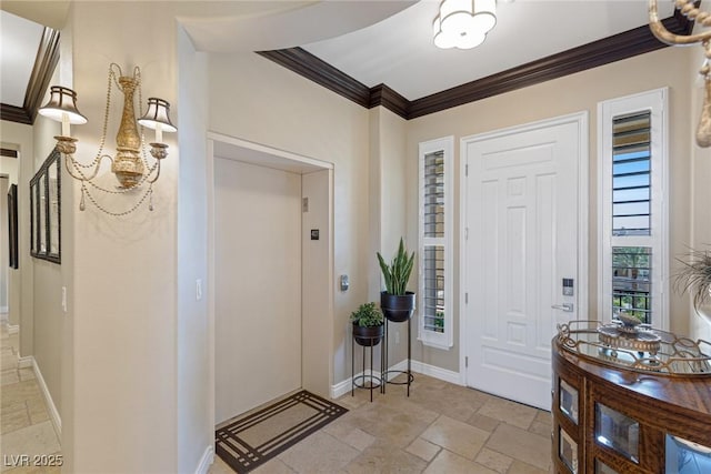 foyer entrance with ornamental molding and elevator