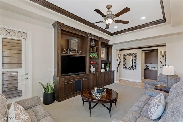 carpeted living room with crown molding and ceiling fan