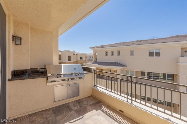 balcony with exterior kitchen and grilling area