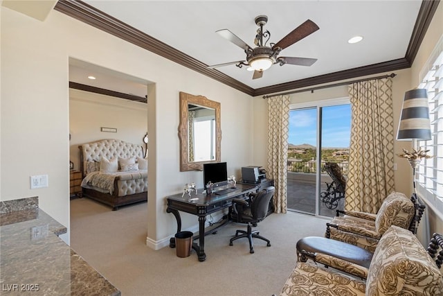 carpeted home office featuring crown molding and ceiling fan