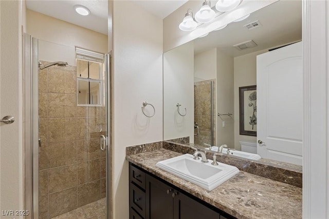 bathroom featuring vanity and walk in shower