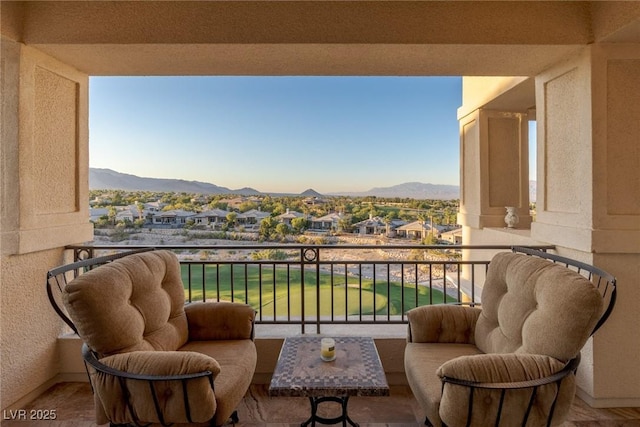 balcony featuring a mountain view