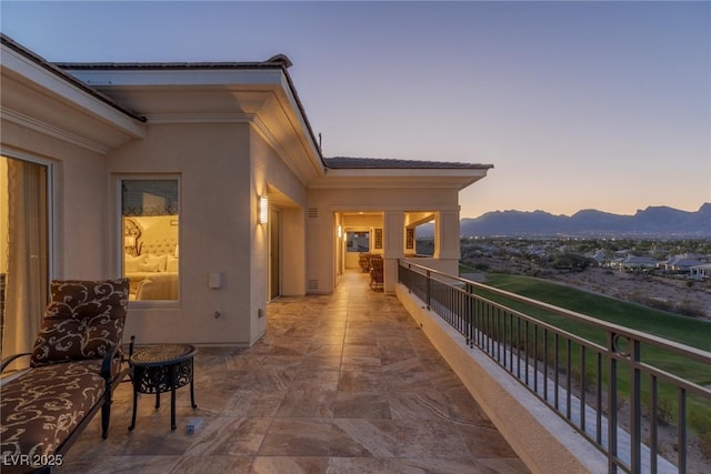 balcony at dusk with a mountain view