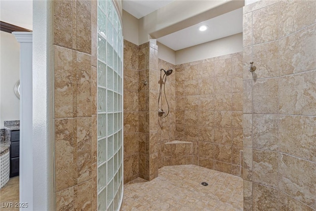 bathroom with a tile shower