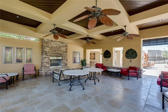 view of patio with an outdoor living space with a fireplace