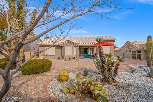 back of property featuring a patio