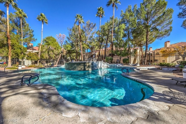 pool featuring fence and a patio