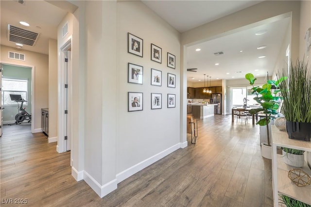 hall with wood-type flooring