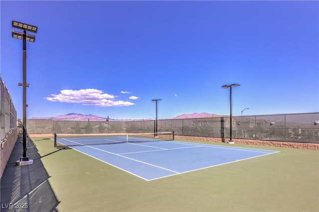 view of sport court with a mountain view and basketball court