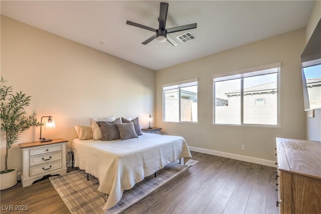 bedroom featuring dark hardwood / wood-style flooring and ceiling fan