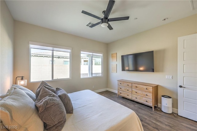 bedroom featuring ceiling fan and dark hardwood / wood-style flooring