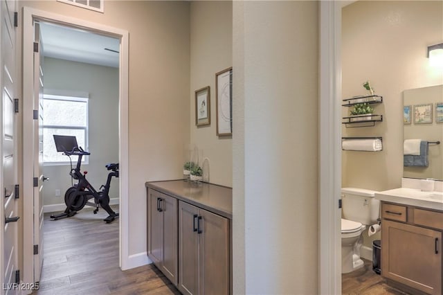 hall with light hardwood / wood-style floors