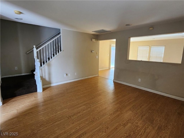 unfurnished room featuring wood-type flooring