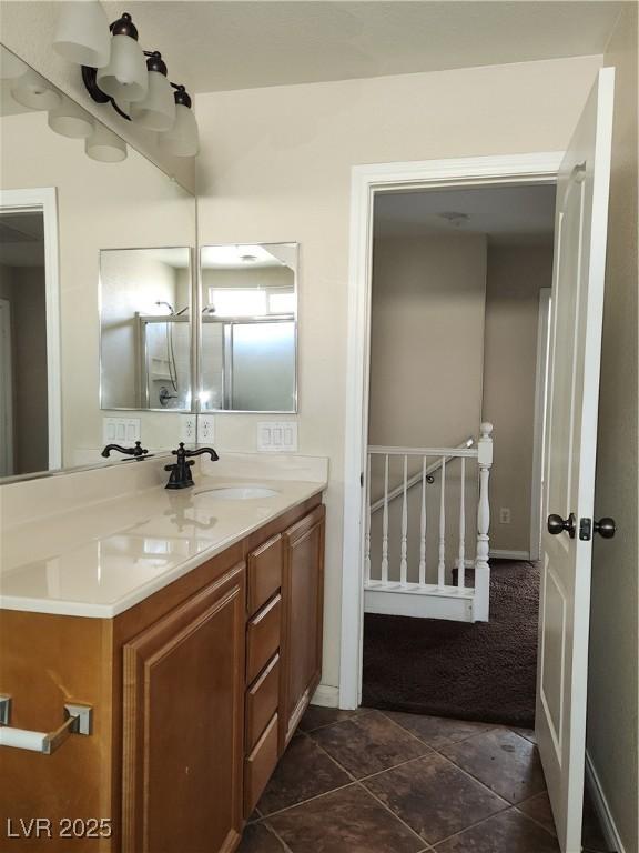 bathroom with tile patterned flooring and vanity