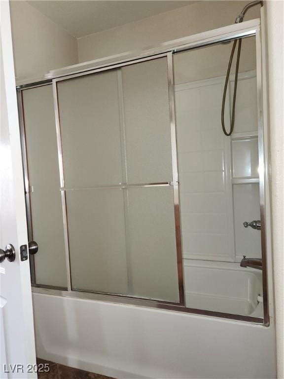 bathroom featuring enclosed tub / shower combo