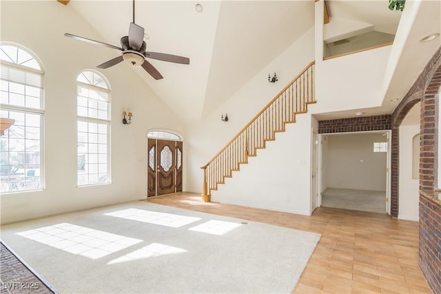 entryway with high vaulted ceiling and a wealth of natural light