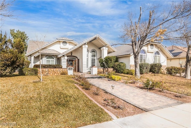 view of front of home with a front lawn