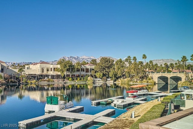 dock area with a water and mountain view