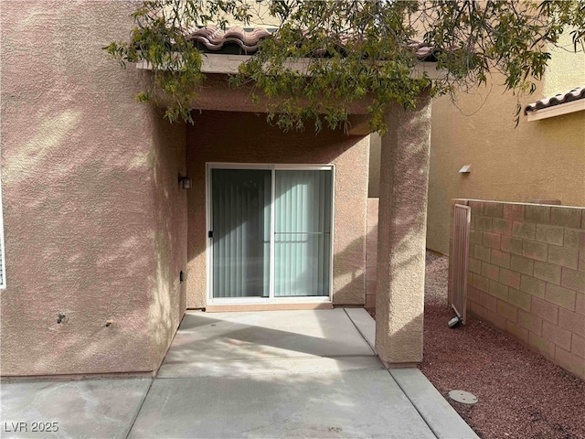 doorway to property featuring a patio