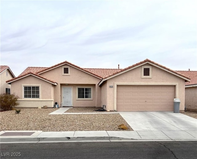 ranch-style home featuring a garage