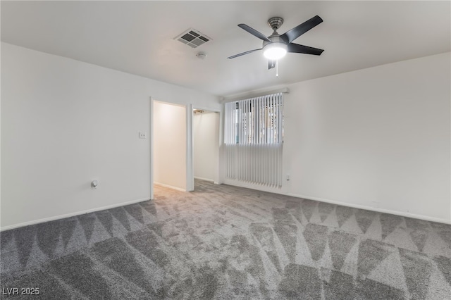 empty room featuring carpet and ceiling fan