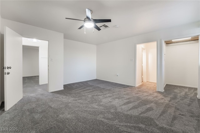 carpeted spare room with ceiling fan