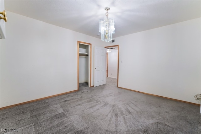 unfurnished bedroom featuring a closet and carpet flooring