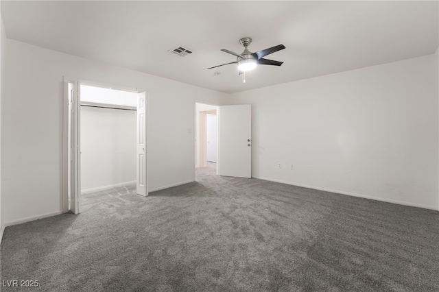 unfurnished bedroom with a closet, ceiling fan, and dark colored carpet